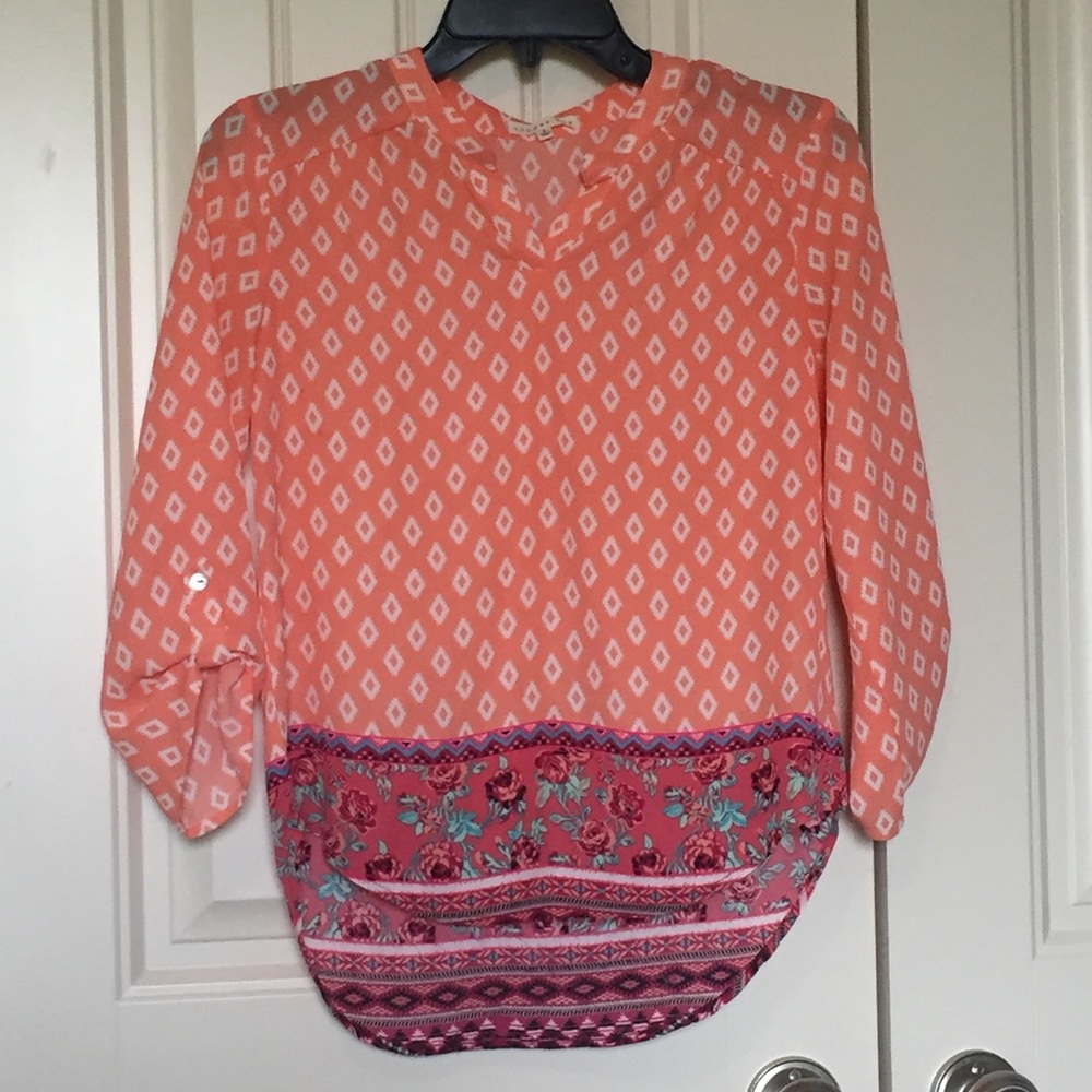Orange blouse with floral design